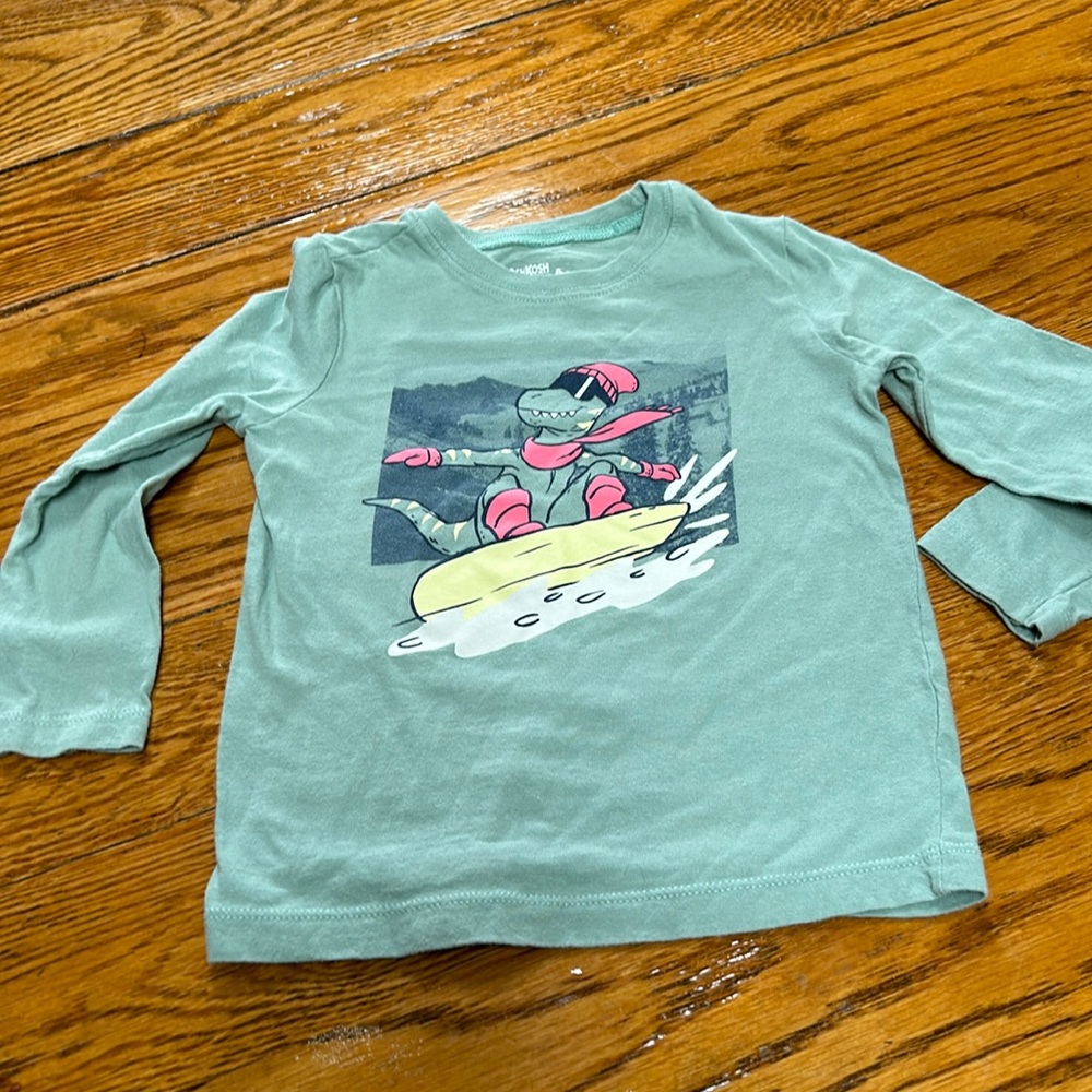 Osh Kosh long sleeve tee. Size 24 months. Green with dinosaur. Great condition
